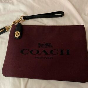 Coach Burgundy Canvas Wristlet with Black Strap and Gold Hardware Accent